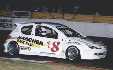 Seef Fourie sr with his new rotary Peugeot, manufactured at his new factory. The car to watch in 2002! The car is too wide (1,8m) for his trailer, so he's lending a sprintcar trailer to haul it